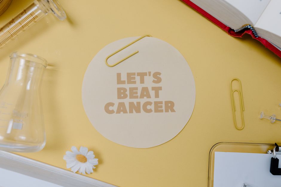 Flat lay with "Let's Beat Cancer" message, encouraging medical and inspirational themes.