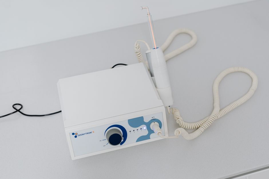 A close-up view of dental machinery on a white table used in modern dentistry.